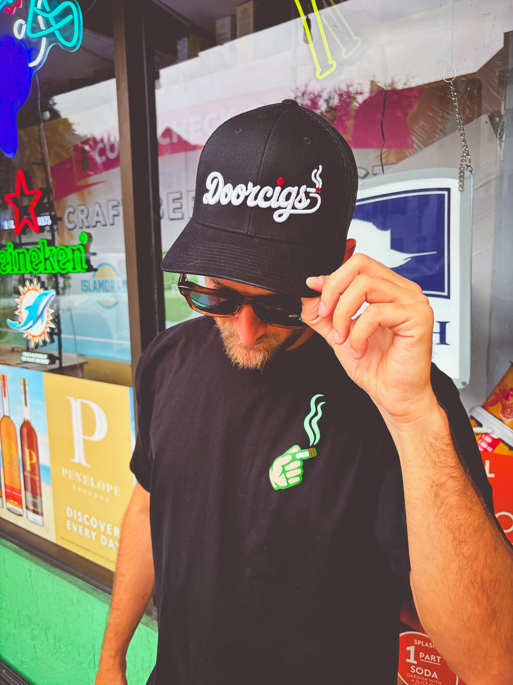 man wearing black snapback streetwear hat