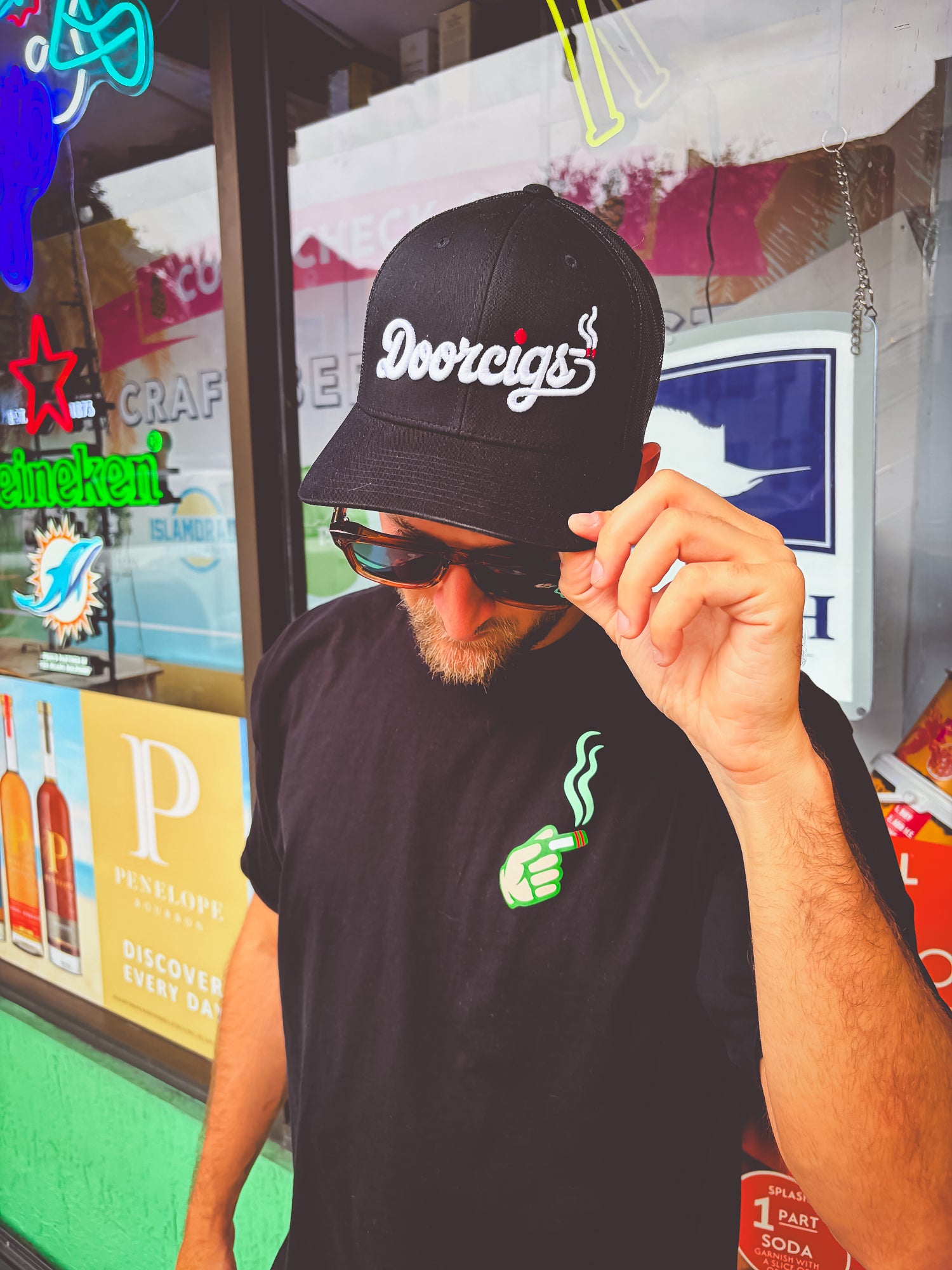 man wearing black snapback streetwear hat