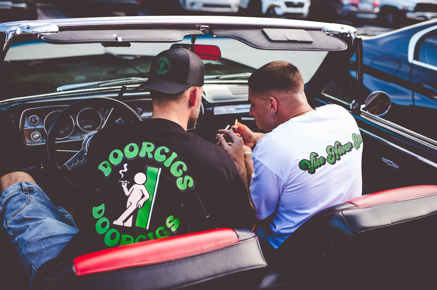 men’s premium streetwear clothing and smoke break tees in a classic car with black and red interior
